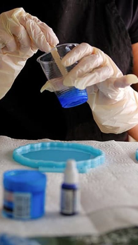 Lacquer polishing on an oak and epoxy resin table in a local workshop