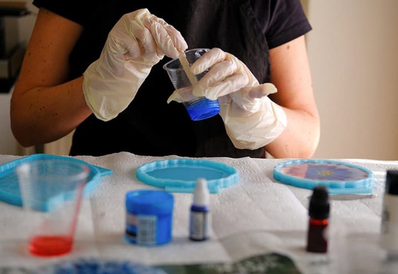 Lacquer polishing on an oak and epoxy resin table in a local workshop