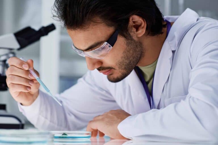 Chemist applying resin